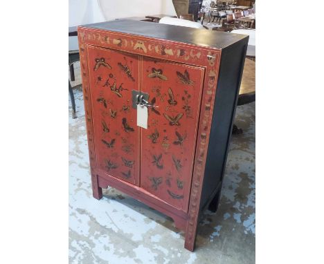 CHINESE CABINET, red and black lacquered, with two panelled doors decorated with butterflies enclosing a shelf, 79.5cm W x 11