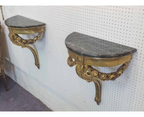 WALL MOUNTED CONSOLE TABLES, a pair, Continental style giltwood framed, each with a demi-lune green veined marble top and flo