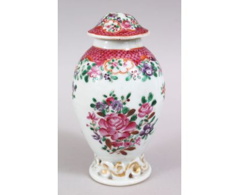 A CHINESE 19TH CENTURY FAMILLE ROSE PORCELAIN TEA CADDY, decorated with floral design, 13cm high.