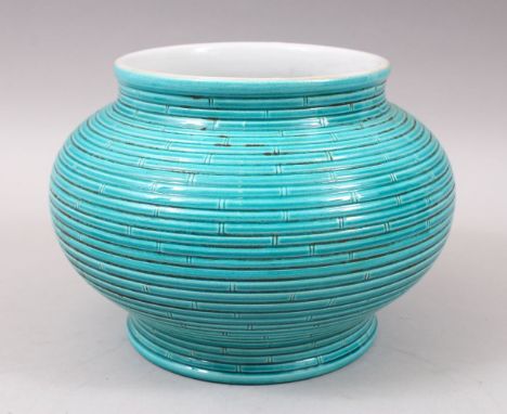 A GOOD CHINESE RIBBED TURQUOISE GLAZED PORCELAIN POT / JARDINIERE, The base with an impressed seal mark, 17cm high x 25cm wid