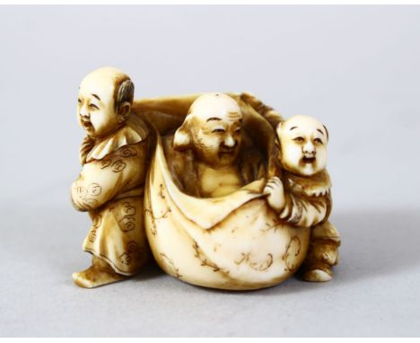 A GOOD JAPANESE MEIJI PERIOD CARVED IVORY NETSUKE OF HOTEI AND ATTENDANTS, hotei seated central within his lucky sack, either