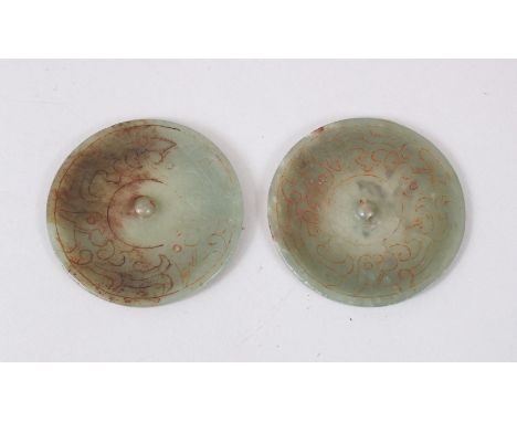 A PAIR OF CHINESE JADE / JADELIKE PENDANTS / BUTTONS, carved decoration, 5.5cm diameter