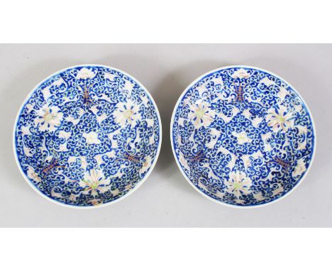 A GOOD PAIR OF 19TH CENTURY CHINESE FAMILLE ROSE PORCELAIN DISHES, decorated with longevity symbols amongst formal flora, the