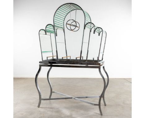 A large birdcage, chrome and glass, circa 1950.&nbsp;Three trays where the cage can be cleaned.&nbsp;Condition report:- There