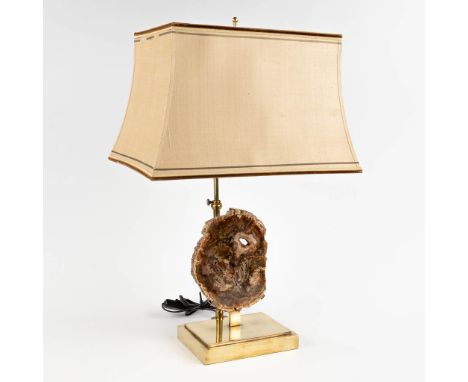 A table lamp with a fossilized tree trunk, circa 1980.In the style of Willy Daro.&nbsp;Dimensions of the fragment: 14 x 18 cm