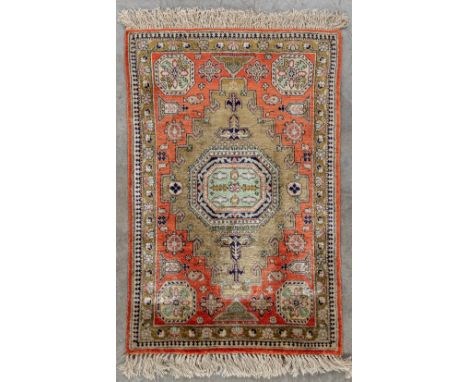 A small Oriental hand made carpet, silk, Ghoum.&nbsp;Dimensions:(D:82 x W:54 cm)
