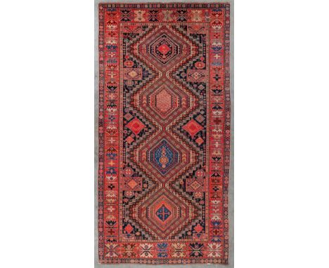 An Oriental hand-made carpet, Shirvan, Kaukasus.Dimensions:(D:305 x W:149 cm)