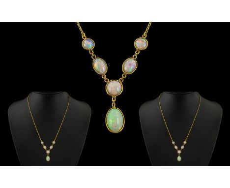 Ladies Attractive Early 20th Century 9ct Gold Opal Set Necklace with Drop of Elegant Form.  Marked 9ct.  The opals of pale bu