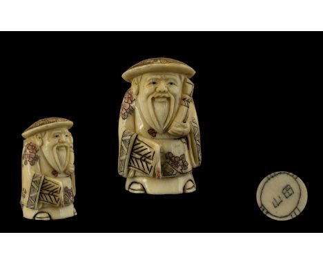 Oriental Carved Netsuke depicting a figural Scholar. Approx 2.5 inches in height.
