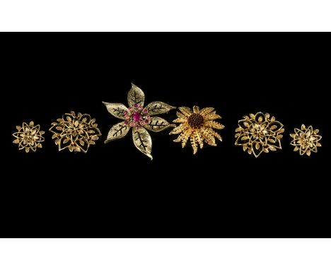 Collection of Five Vintage Gold Tone Sarah Coventry brooches.  One brooch with matching earrings of flowerhead design; one go