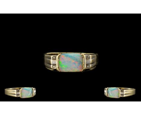 18ct Gold Attractive Opal and Diamond Set Dress Ring. The Rectangular Shaped Opal of Good Colours. Est Weight 1.00 ct, Marked