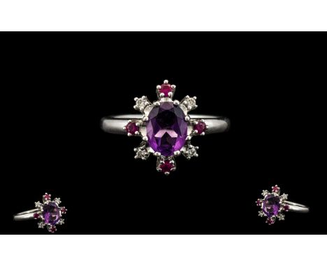 Superb Quality 18ct White Gold Top Quality Amethyst - Ruby and Diamond Set Dress Ring. The Central Faceted Amethyst Surrounde