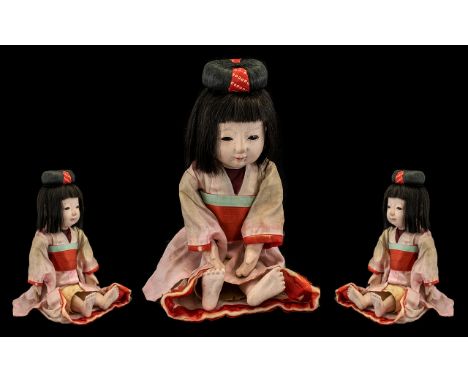 Vintage Japanese Ichimatsu Doll with original pink kimono with red sash, glass eyes and hair in bun.  See accompanying images