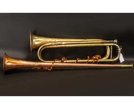 A Brass Trumpet with silver mouth piece. Marked 'van muziekinstrumenten tilburg'. Together with a copper and brass bugle.