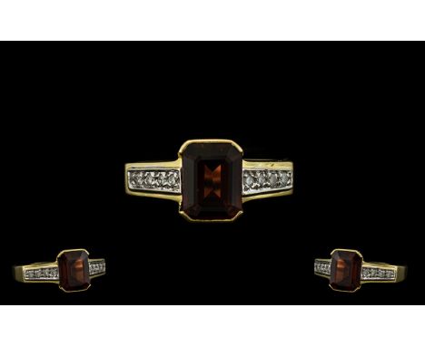 18ct Gold Garnet and Diamond Set Ring of Attractive Form. The Central Emerald Cut Garnets of Good Rich Colour. Est Weight 1.2