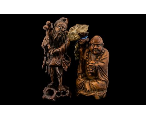 A Japanese Root Wood Figure of A Street Seller with bone inset eyes and mouth. Raised on a naturalistic base. Circa 1900 Heig