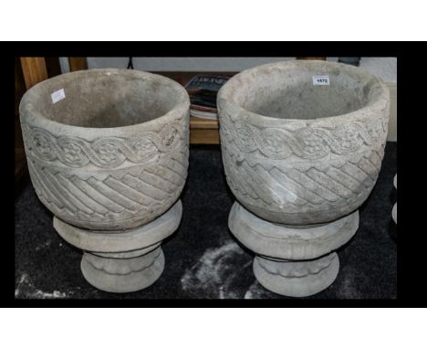 Two Mayan Urns - circular planter decorated with Aztec design on circular base.