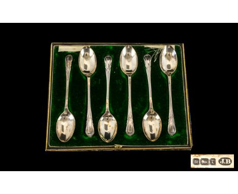 A Set of Six Boxed Silver Tea Spoons with plain bowls with stylised leaf terminals. Hallmarked for Sheffield R - 1909. Comple