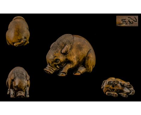Japanese - Good Quality and Signed Late 19th Century Boxwood Netsuke, The Carving Depicts a Warthog In a Crouching Position. 