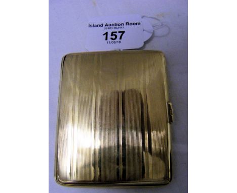 An engine turned 9ct gold cigarette case - 58 grams