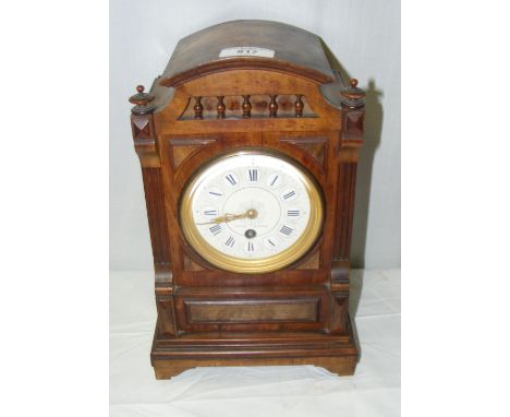 A walnut cased mantel clock timepiece with white enamelled dial and Roman numerals by Dyson, Windsor - 31cm
