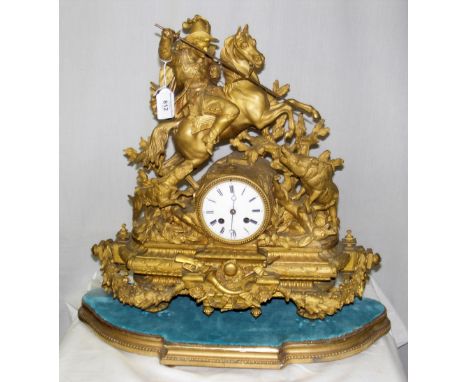 A 19th century French gilt metal mantel clock with Japy Freres movement striking on bell surmounted with a mounted huntsman a