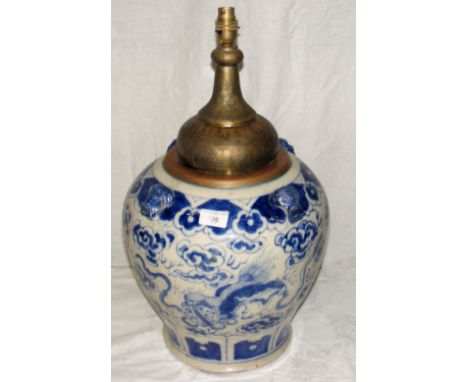 A Chinese blue and white ceramic table lamp with chased and engraved brass top - 57cm high overall