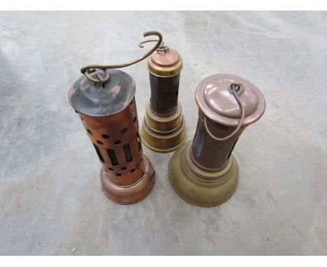 Two vintage brass bonnet lamps and a copper example (3)
