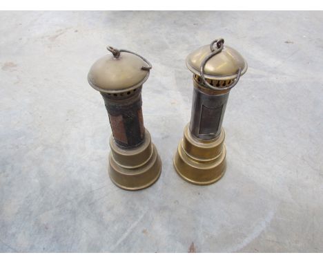 A pair of vintage brass bonnet lamps