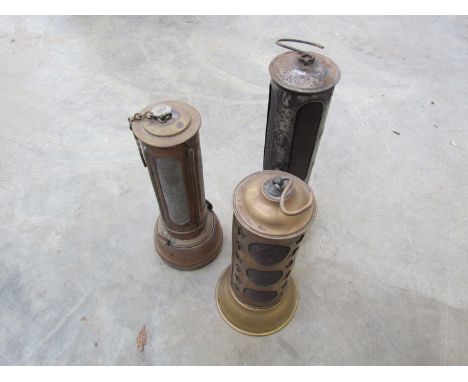 Three vintage brass bonnet lamps including Desmo