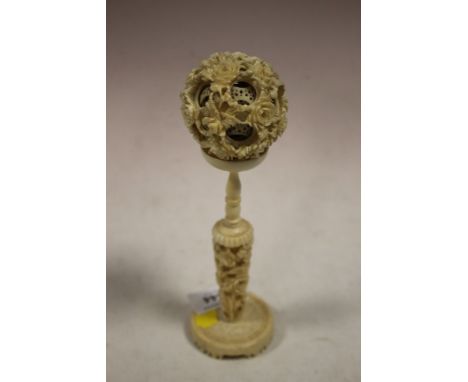 A VINTAGE PUZZLE BALL ON STAND 