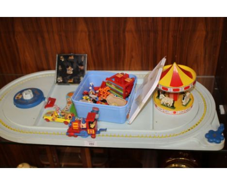 A 1970S CORGI MAGIC ROUNDABOUT PLAY SET TOGETHER WITH A SET OF ENAMEL MAGIC ROUNDABOUT PIN BADGES 