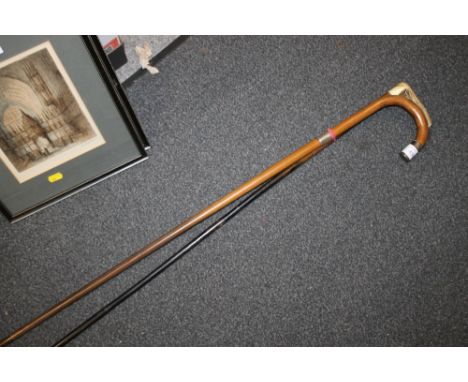 A VINTAGE SILVER COLLARED WHITE METAL HANDLED WALKING CANE TOGETHER WITH A BONE HANDLED EXAMPLE