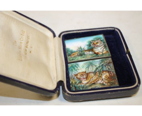 TWO UNUSUAL ENAMEL ON SILVER PLAQUES FEATURING A LION AND A LEOPARD STAMPED 'SILVER' 