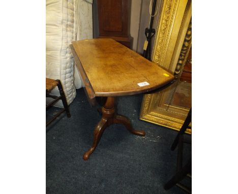 AN ANTIQUE DROPLEAF TABLE ON TRIPOD BASE