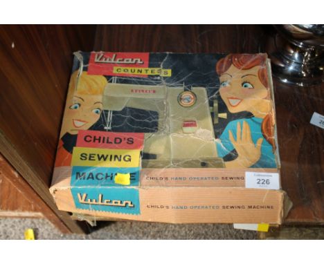A BOXED VINTAGE VULCAN COUNTESS CHILDS HAND OPERATED SEWING MACHINE 