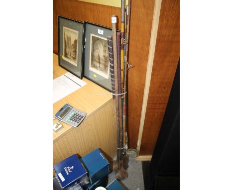 A SELECTION OF VINTAGE FISHING RODS AND WOODEN HANDLED GOLF CLUBS 