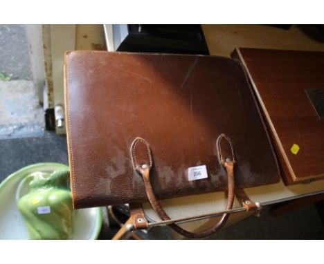 A VINTAGE LEATHER MUSIC CASE & CONTENTS