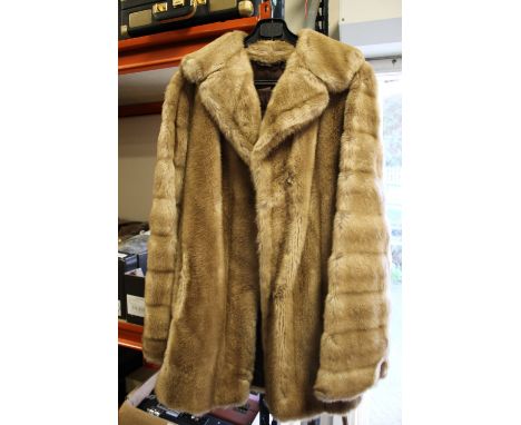 A LADIES LIGHT FUR JACKET 