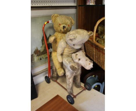 AN INTERNATIONAL MODEL AIRCRAFT LTD VINTAGE PUSH ALONG DOG TOGETHER WITH TWO VINTAGE TEDDY BEARS (3)