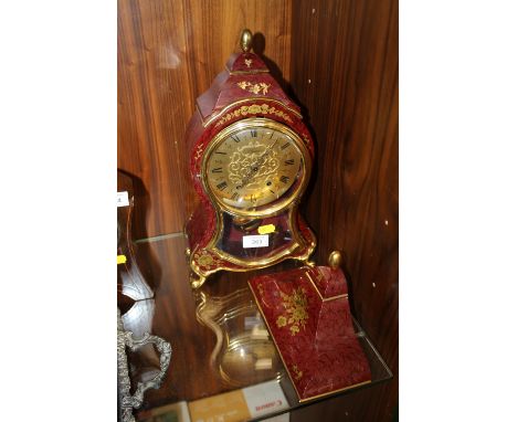 A METAL 'ELUXA' MANTLE CLOCK AND MATCHING CORBEL 