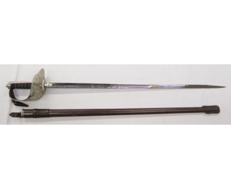 An Elizabeth II Royal Marines Dress Sword by Wilkinson with leather scabbard and outer protective sleeve, sword 98 cm and bla