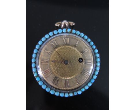 An 18ct Gold Fob Watch with engine turned gold dial and back and three concentric bands of turquoise, the centre band with al