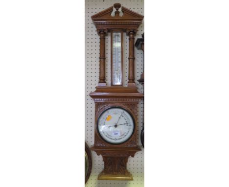 A Nineteenth Century Carved Oak Cased Barometer incorporating thermometer, 81 cm high