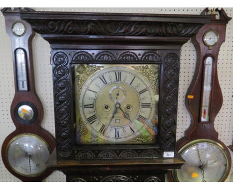 An Eighteenth Century Carved Oak Eight Day Long Case Clock by Thomas Shindler Canterbury, the 12 in. dial with brass spandrel
