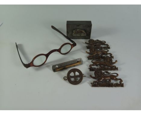 A Small Selection of THE KINGS OWN Army Badges, vesta sleeve, specs etc