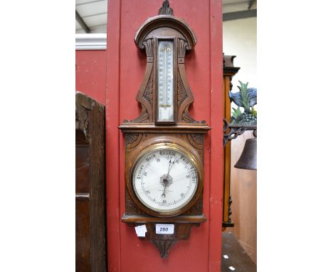 A Johnson & Son of Derby carved oak wall hanging barometer thermometer, creamy white scale and register, 55cm long