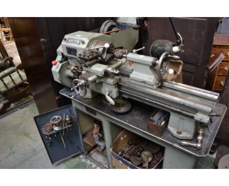 A Boxford CSB single phase lathe eight forward gears and eight reverse gears with compound slide, assorted tools including, c