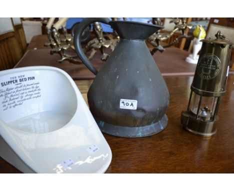 A brass Eccles miner's lamp; a copper flagon; a white glazed bed slipper pan (3)