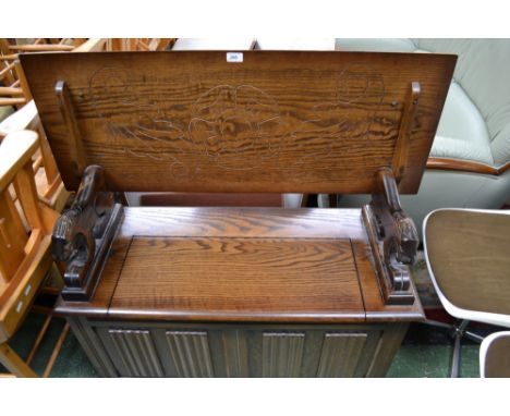 An oak linenfold monk's bench